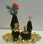 BLACK PERFUME BOTTLES ON GOLD TRAY